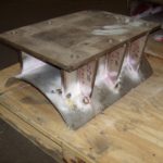 Custom pipe saddle ready for insulation attachment