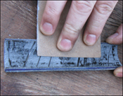 Using an emory cloth to rough the interior of FRP Pad